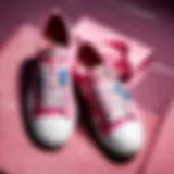 Pink canvas sneakers with floral embellishments